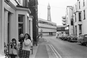 A brilliant scene which shows a young family outside their back street B&B in 1974