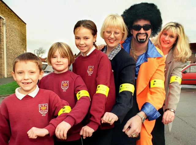 Lionel Vinyl joined in at the presentation of Glow Power armbands at Grange Park Junior School in 1999. With Lionel are, from left: Barry Wenman who was sevent, Andrea Cowen (9), Leanne Bottomley (9), Jackie Wild from Moorland Motors) and Road Safety Officer Carol Bracegirdle