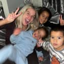 Helen Flangan with her three children in her lounge. Credit: hjgflanagan on Instagram