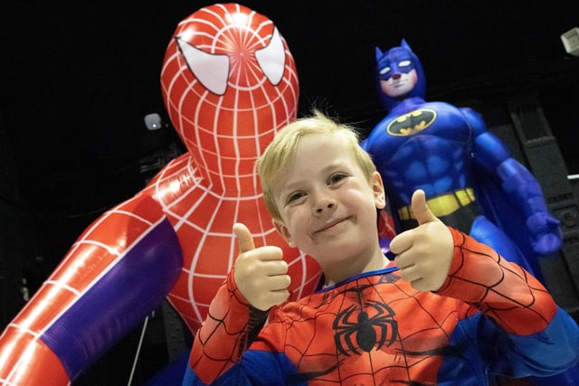 Riley Whittaker Jenkins with Spiderman and Batman.