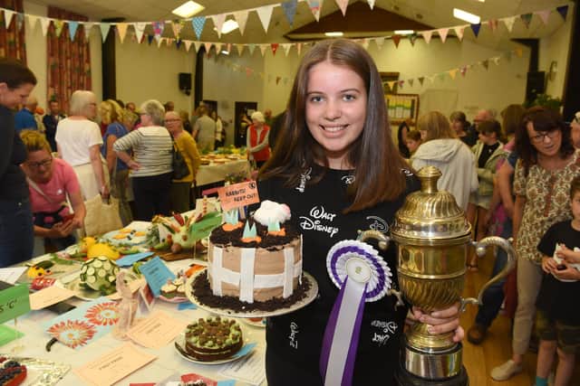 Sophie Hindle with her award winning cake at Freckleton Horticultural Show. Picture: Neil Cross.