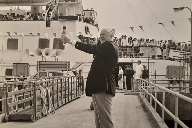 Former QE2 captain Bob Arnott fires the rocket to signal cast off in July 1986