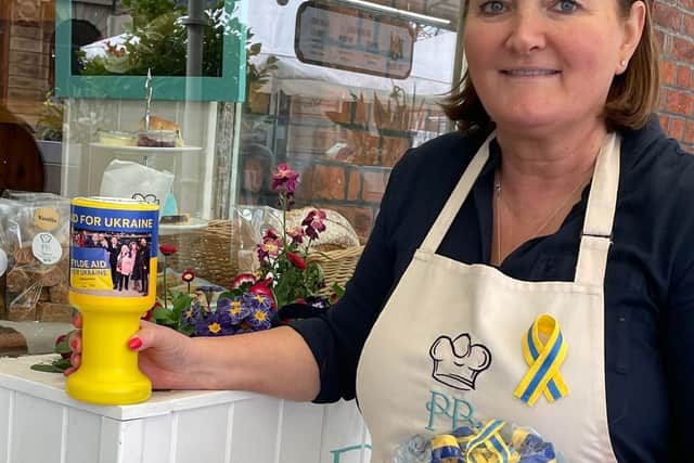 Jacqui Adams with the ribbons at Phil's Bakery in Lytham
