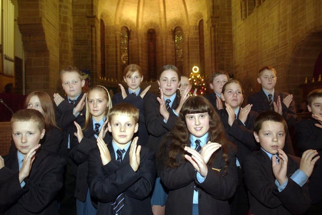 Children from Collegiate High School performing their Cristmas Carol concert in sign language at St Mark's Church, Layton