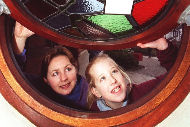 Nine year old Katie Vernon, with the stained glass window she designed at Marton County Primary School and Davia Walmsley, from Daedalian Glass