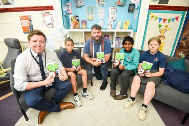 Nathan Parker with English lead Thomas Chadwick and pupils J'Kwon Grant, 10, Aadidev Nair, 10 and Angel Millwood, 9.