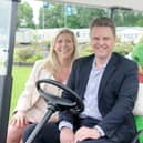 Andrea Challis and Robert Kearsley celebrate the 70th anniversary of Partingtons at Windy Harbour Holiday Park with Grunty the firm's mascot.