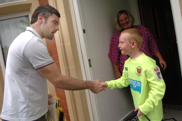 Blackpool FC keeper Matt Gilks pays a surprise visit to seven-year-old Mark Anthony Bairstow, who was the first member of the clubs new young fans scheme
