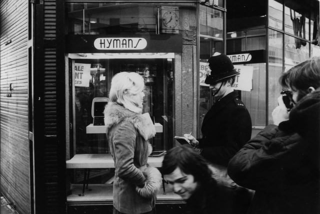 Beauty queen Barbara Smith took part in a staged smash and grab raid at Hymans as a novel way of celebrating the store's revamp and centenary in 1977