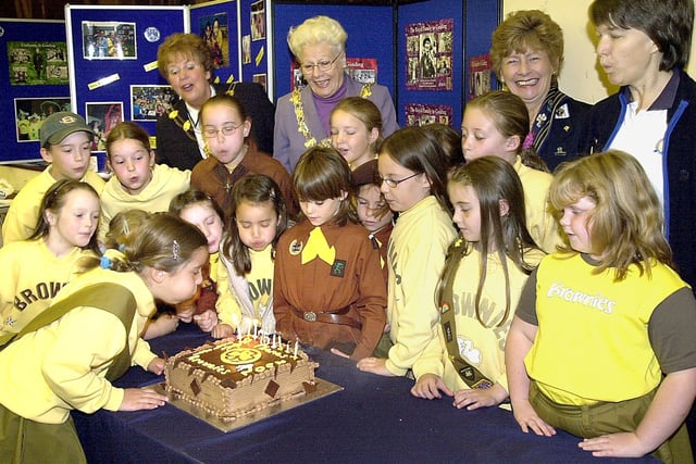 Brownies at St. Thomas' Church, St. Annes, celebrated their 75th anniversary. Seven-year-old Hannah McNeil (left), blows out the candles on their birthday cake, watched by fellow members of the 4th St. Annes (St. Thomas') Brownies, after their thanksgiving service. Also pictured, are back (from left), the Mayoress of Fylde Mrs Maxine Chew, the Mayor of Fylde Councillor Hannah Cummings-Miller, Elaine Robinson (president Girl Guiding Lancashire West) and Sue Allen (4th St Annes Brown Owl and Fylde south divisional commissioner