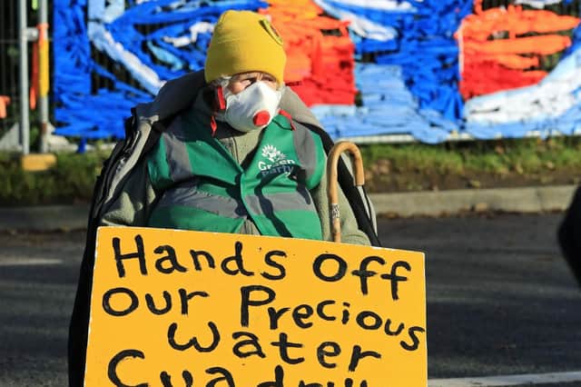 An anti-fracking protester warning of the millions of gallons of water used by each well, outside energy firm Cuadrilla's site in Preston New Road, Little Plumpton in Lancashire. The site was the scene of much protest during the fracking process and police made several arrests over the years mainly of people blocking the site entrance or preventing lorries entering and thus causing traffic jams on the nearby road