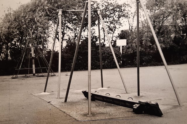 Damaged play equipment at Devonshire Road playground on the brutal concrete surface. Remember those cone shaped climbing frames in the background?