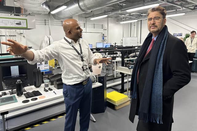 Dr Vivek Koncherry, CEO of Graphene Innovations Manchester (right), with Afzal Khan MP. Photo:  The University of Manchester