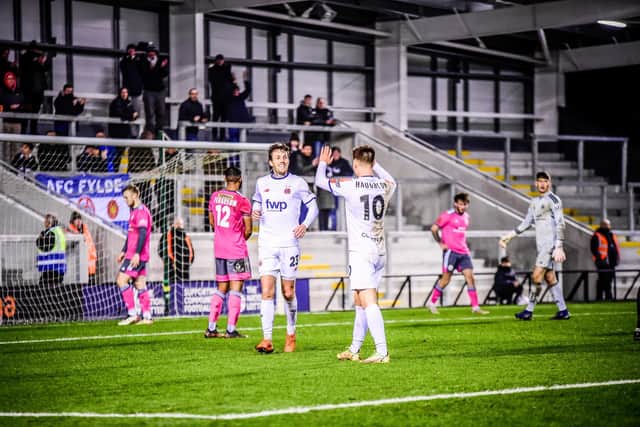 Nick Haughton celebrates with goalscorer Danny Whitehead in AFC Fylde's 4-1 win over Boston United Picture: STEVE MCLELLAN