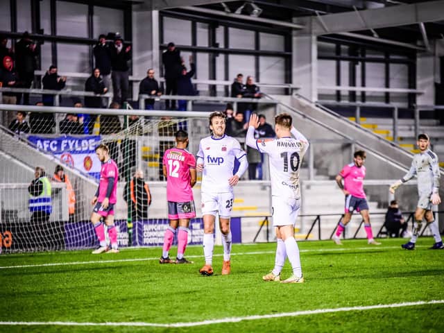 Nick Haughton celebrates with goalscorer Danny Whitehead in AFC Fylde's 4-1 win over Boston United Picture: STEVE MCLELLAN