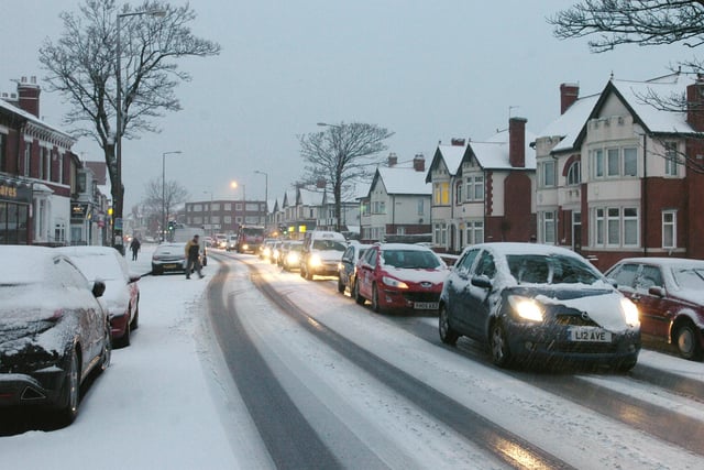 Stationary traffic on Whitegate Drive during heavy snowfall