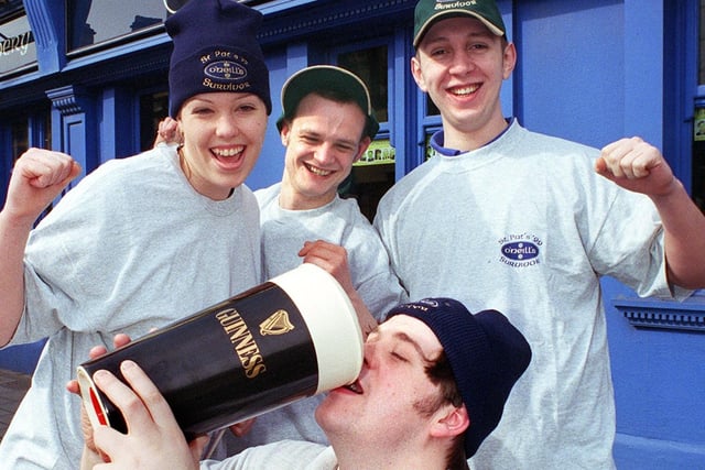 Assistant Manager Danny Kearns gets into the St Patricks Day celebrations at O'Neill's, on Talbot Road, watched by staff  Cath Duff-Cole, Jimmy Wood and Darren Ryder in 1999