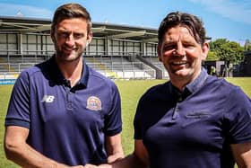 Goalkeeper Chris Neal is congratulated on his new contract by AFC Fylde director of football Chris Beech Picture: AFC FYLDE