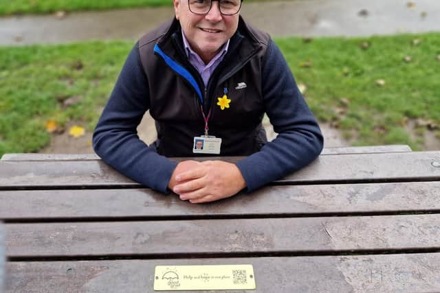 Coun Gerard Walsh with the plaque at Louie Horrocks Park