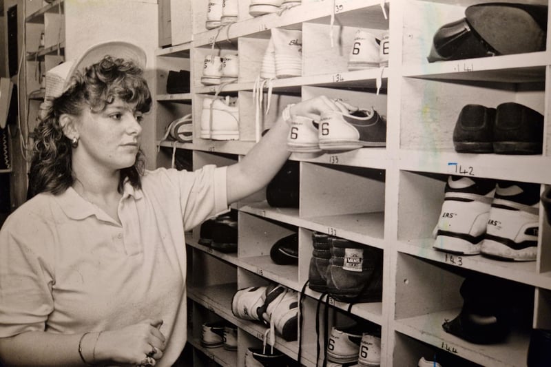 This was February 1990 - Michelle Morris was checking out the bowling shoes ready for customers. The caption doesn't say where though?
