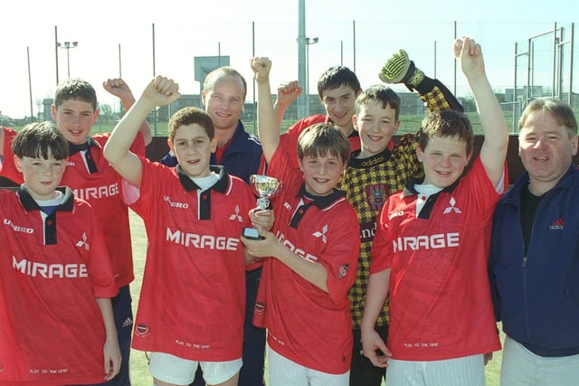 Warbreck winners of the U12 cup at UFORIA (Collegiate High School). From left, Ryan Mahon, Chris Brooke, Chris Paraskeva, Martin Booker (UFORIA manager), Alex Mingas, Jack Southern, James Rice,Jamie Havill and Geoff Havill (manager) 2000