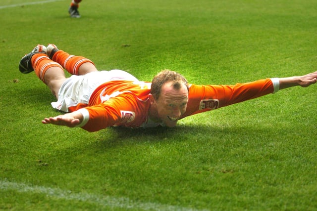 Sliding across the turf in traditional style - Blackpool's Andy Morrell celebrates his goal
