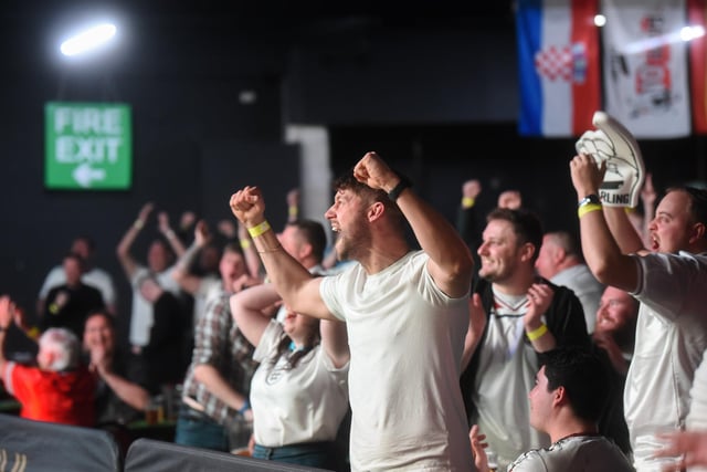 Supporters at the Winter Gardens World Cup Fan Zone celebrate as another England goal goes in.