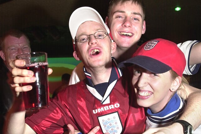 Fans celebrate during the England against Nigeria match in Brannigans in 2002. L-R, Chris Livingstone, Chris Doyle (21 today), and Kelly Anderson