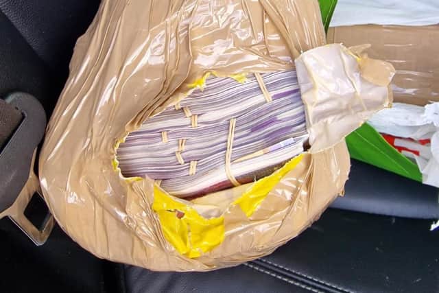 A man was arrested after £250,000 in cash was found in a car near Leyland (Credit: Lancashire Police)