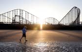 Prime Minister Boris Johnson running along Blackpool beach on the final day of the Conservative Party Spring Conference 
Photograph credit: Conservative Party/ @Conservatives