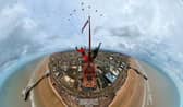 Two thrill-seekers scaled the 518ft Blackpool Tower for a selfie with a Red Arrows display. Adam Collins, Officer Commanding the Red Arrows, was at the top of the flag pole on the tower saluting them as they flew past. See SWNS story SWMRtower. 
