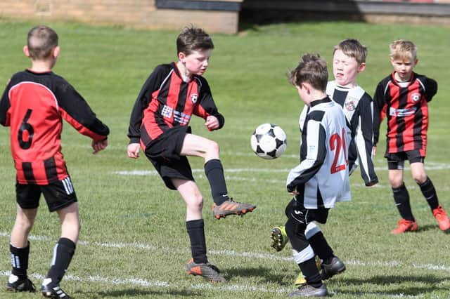 Action from Poulton Trojans (red and black) v Wyre Diamonds (white and black). Photo: Kelvin Stuttard