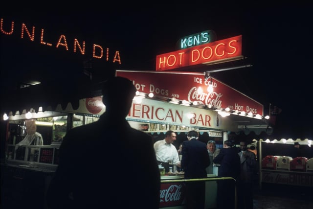 The caption on this says 'a shadowy customer approaches Ken's Hot Dogs stand in Blackpool'. Away from the bright lights, seaside towns can also be perceived as shabby and shady. Sadly, Blackpool is no different