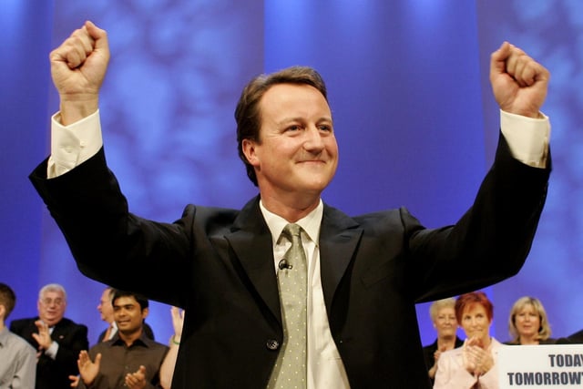 David Cameron, who was the conservative leadership candidate at the time, salutes the audience following his speech to the Conservative Party conference in Blackpool in 2005