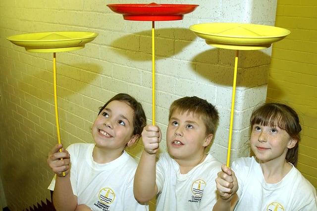 Blackpool Circus School at Claremont Primary School From left, pupils Mizkha Rogan (8), Connor Buchan (8) and Casey White (8) learning plate spinning.