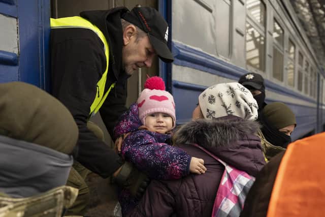 A mother and baby fleeing Ukraine.