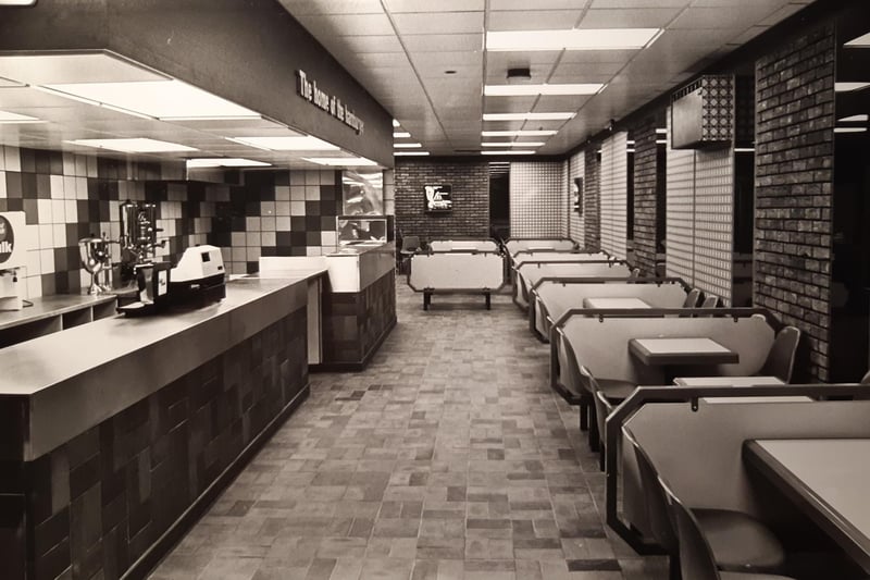 This is the inside of Wimpy, with its booths of tables in 1980