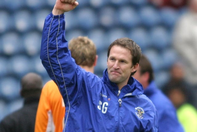 Simon Grayson celebrates with the away fans at full-time