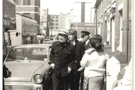 John Lennon and George Harrison take a stroll whilst in Blackpool for their performance at the ABC, August 1965