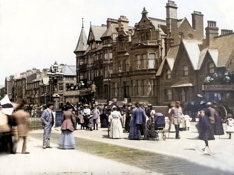 An injured soldier and a nanny with baby carriage are among those promenading along the seafront in South Shore in 1800s.