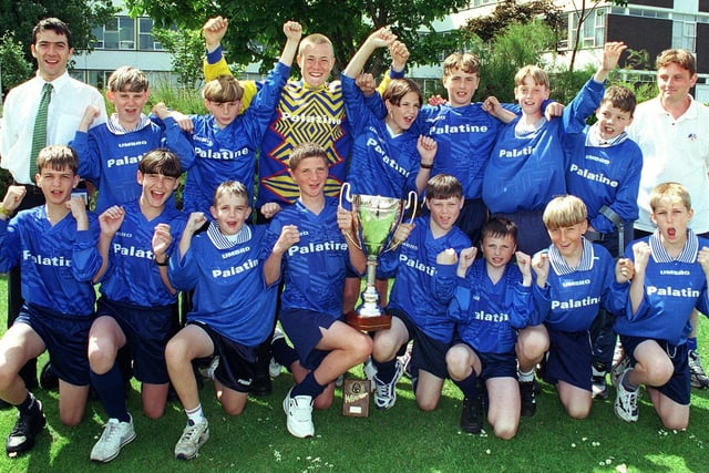 Palatine High School year 8 soccer team who won a competition in Belgium, with their Gazette trophy. Back row from left: Dave Seal (asst. manager), Chris Whiteside, Philip Mortlock, Ryan Yeomans, Ben Blanchard, John Casey, Stefan Andrews, Adam Morrell, Gavin Grant (manager).  Front from left: Ryan Jones, Todd Rogers, Steve Hirst, Antony Pearson (Captain), Mark Trubby, Clark Gratton, Ben Hall and Matthew Doughty.