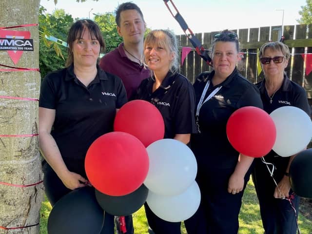 Young people mark 100 years of the YMCA on the Fylde Coast by giving back to the community.