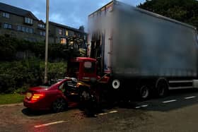 The lorry was parked up in Rawtenstall, Lancashire with the driver soundly asleep in his cab when the Mercedes crashed into the rear of it, becoming trapped and crushed underneath the tail mounted forklift. (Photo by Lancashire Police)