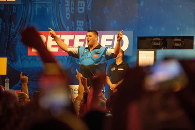 Daryl Gurney celebrates his stunning first-round win over Gary Anderson at the Winter Gardens