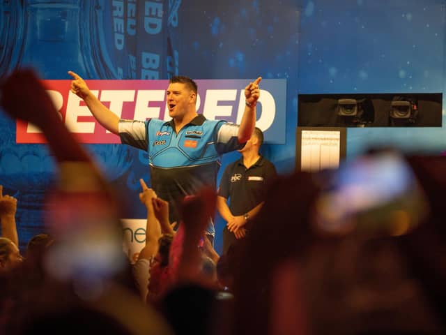 Daryl Gurney celebrates his stunning first-round win over Gary Anderson at the Winter Gardens