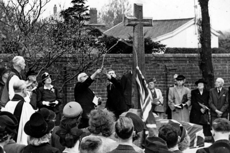 A cross is unveiled, in May1947, to the memory of those who were killed