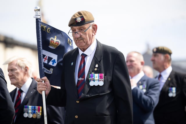 A veteran proudly holds a standard  during the 40th anniversary Falklands War parade in Blackpool.
