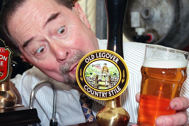 The Saddle Inn  Licensee, Don Ashton, checks up on some of the more unusually named brews at the pub's Beer Festival in 1998
