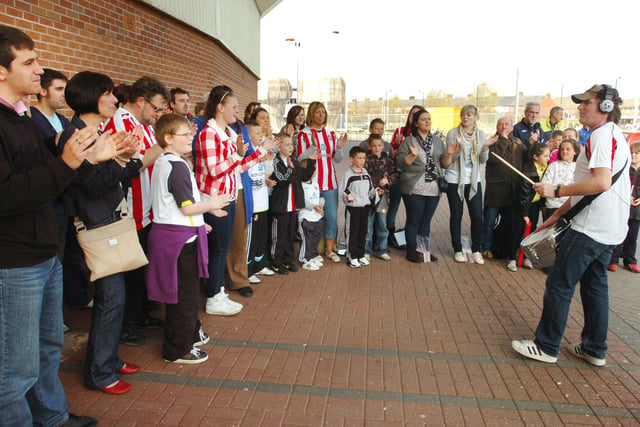 Sunderland fans singing the chorus to the Sunderland Foundation CD 'Keep it Rollin' before the match with Burnley in 2010.