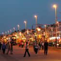 A promenade scene shows a busy Blackpool seafront